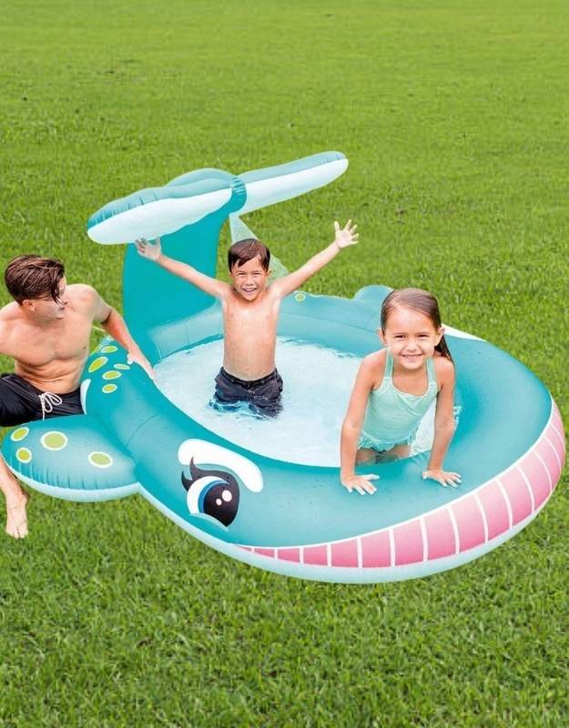 Kids playing in the Intex Whale Spray Pool with canopy and water sprayer